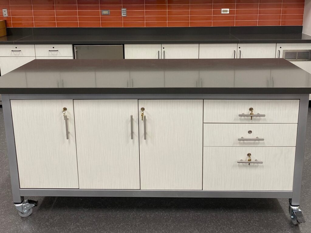 maker demonstration table with stone top, helen plum library