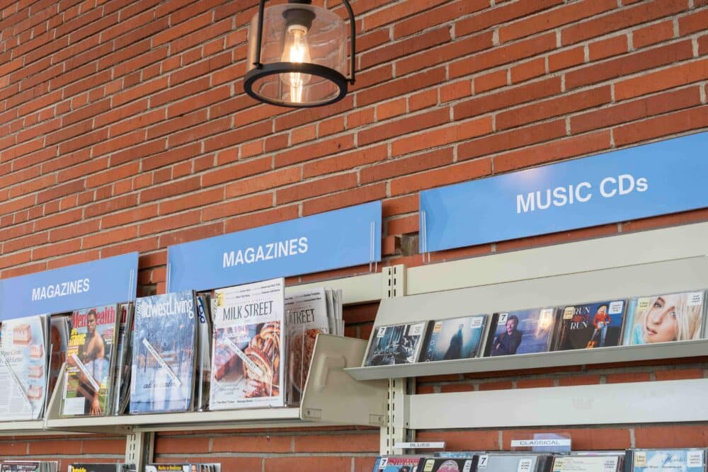 magnetic sign holders on single-faced shelving